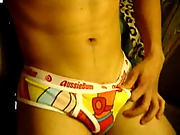 Charming gay boy in motley underwear shows off his meat